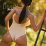 Realistic Mizuki sex doll by MyRealDolls showing detailed facial features and realistic body in a natural pose.