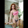 Realistic Bobbie sex doll by MyRealDolls with detailed facial features, realistic skin, and life-like body in a seated pose.