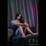Realistic Carmel sex doll from MyRealDolls, featuring detailed facial features, blonde hair, and lifelike body contours.