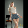 Realistic Evelina sex doll by MyRealDolls showcasing detailed facial features and lifelike body in a natural pose.