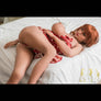 Red-haired Camden sex doll by MyRealDolls featuring realistic facial features and detailed body design for adult use.