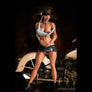 Everly Tanned Sex Doll by MyRealDolls featuring realistic facial features, detailed body, and lifelike skin texture.