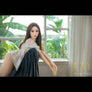 Asian sex doll from MyRealDolls featuring realistic facial features and detailed body in a lifelike pose.