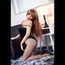 MyRealDolls Kiera Tall Sex Doll with realistic features and long blonde hair, dressed in a stylish outfit.