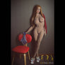 Realistic Rosie Red-Head Sex Doll by MyRealDolls featuring detailed facial features and red hair, lifelike body and pose.