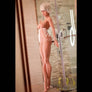 Violette Tall-Busty Sex Doll by MyRealDolls featuring realistic facial features, long hair, and detailed body contours.